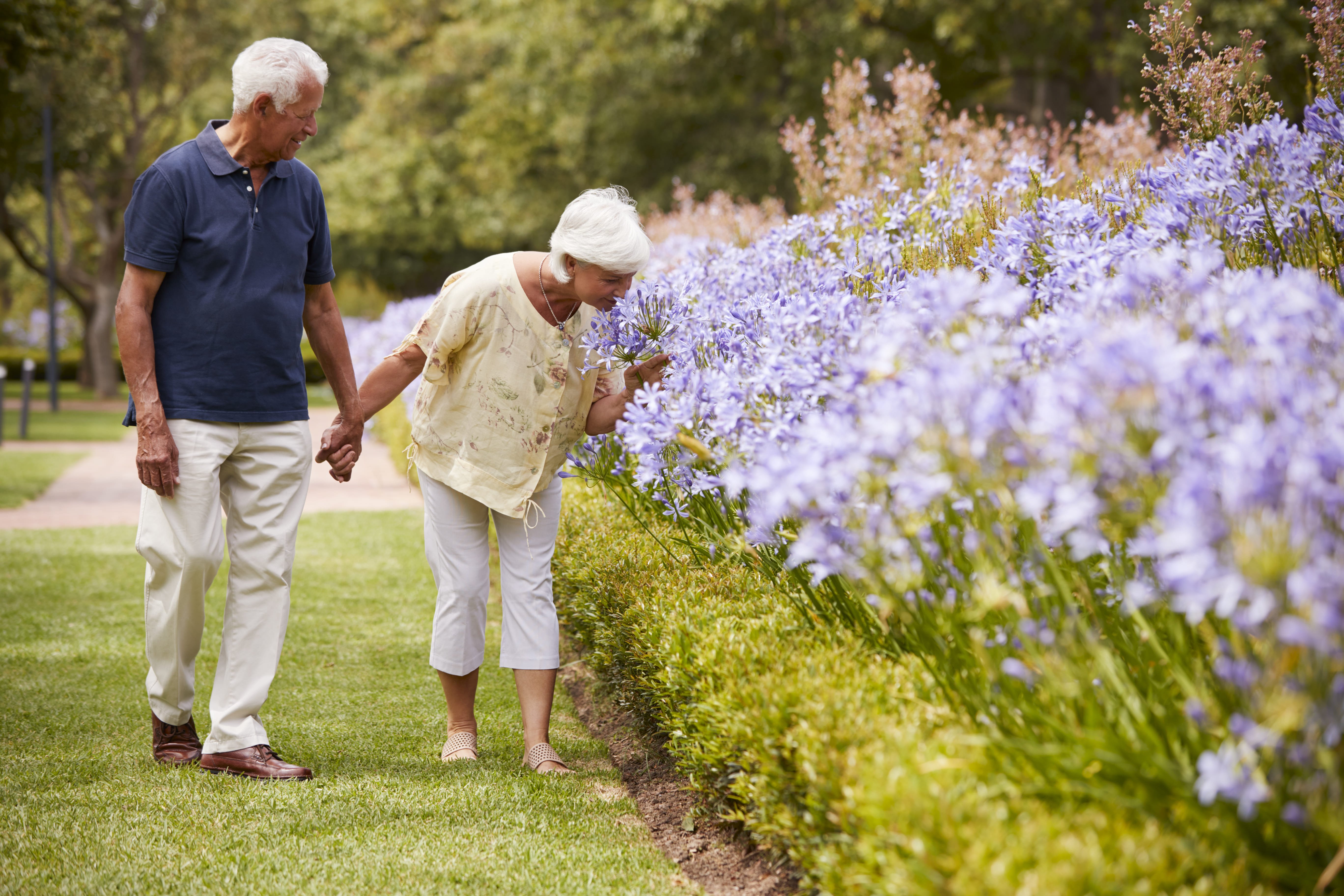 Woman and man walking in the park.