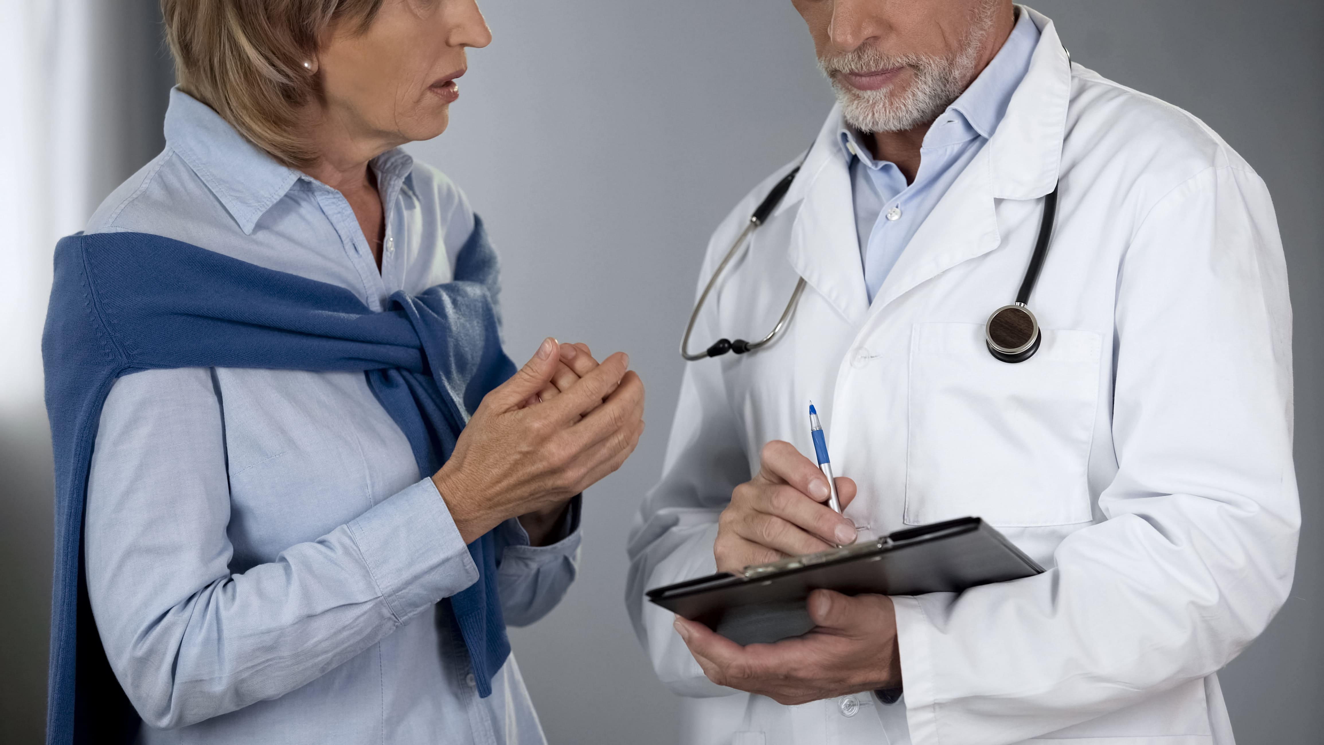 Woman discussing test results with her doctor.