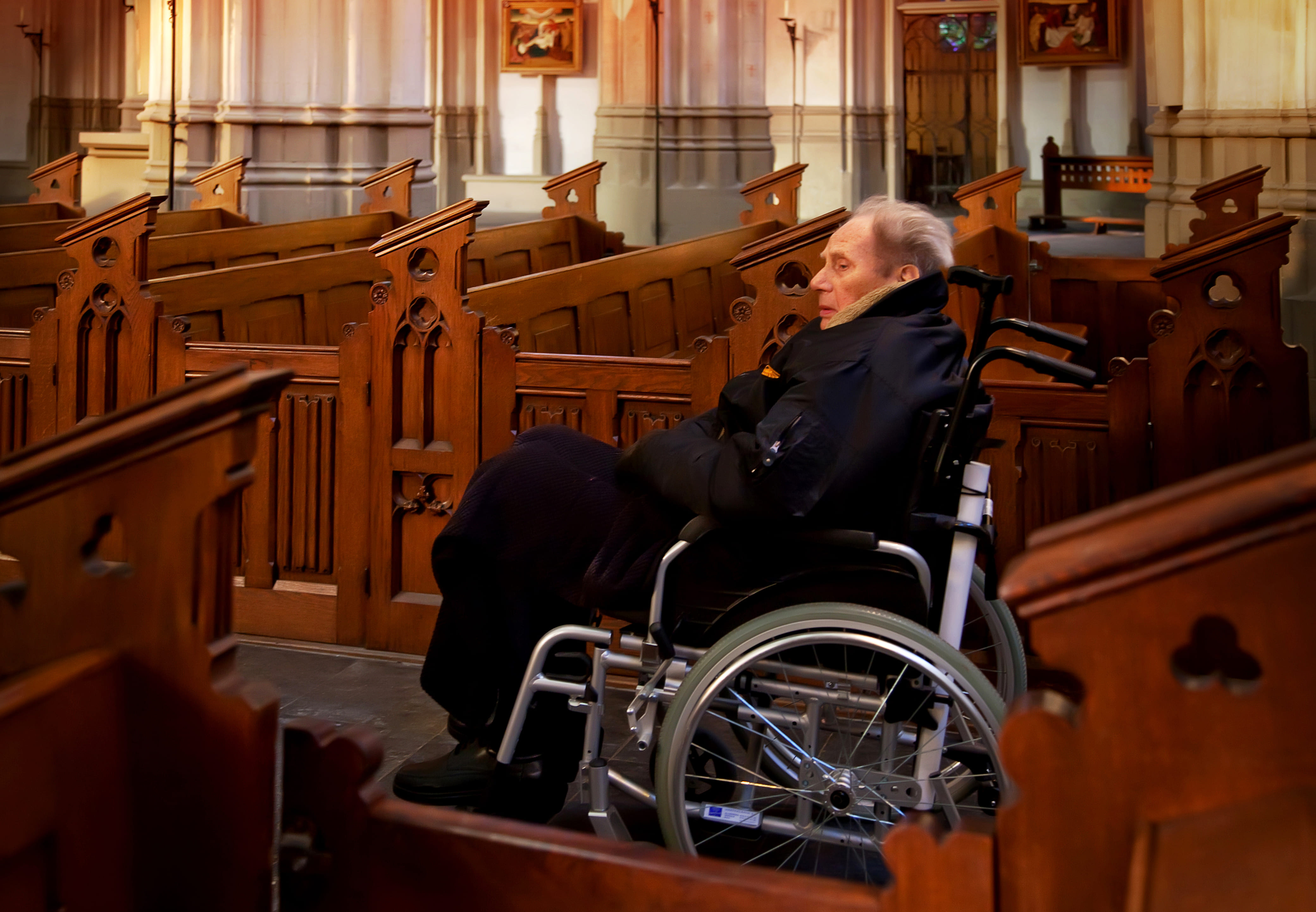 Woman in wheelchair at church.