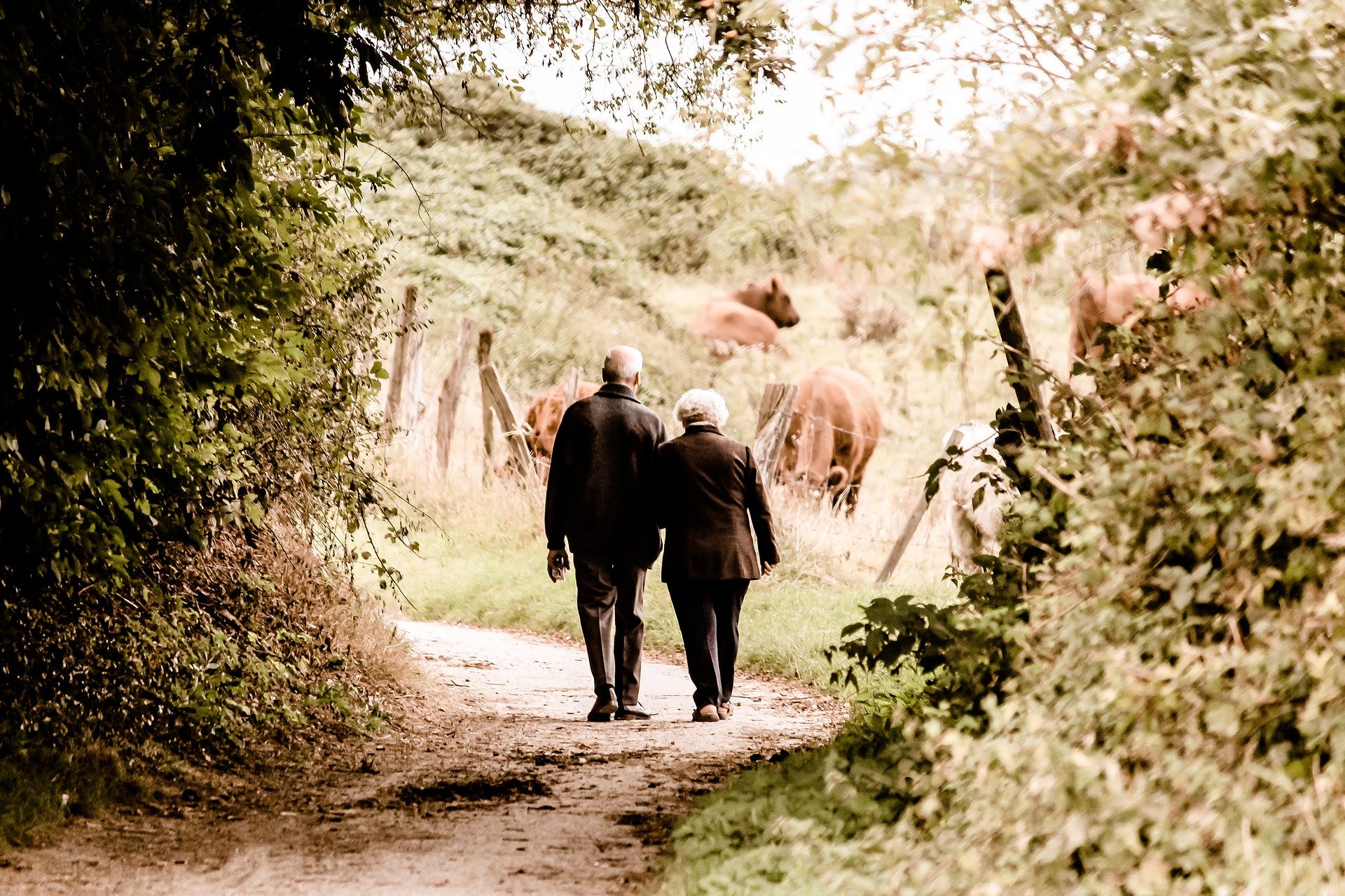 Man and woman walking outdoors.