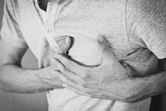 man experiencing chest pain.