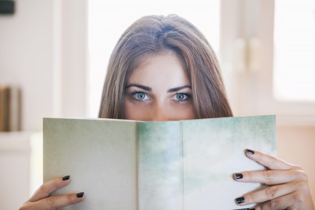 Female Student Looking Over A Book