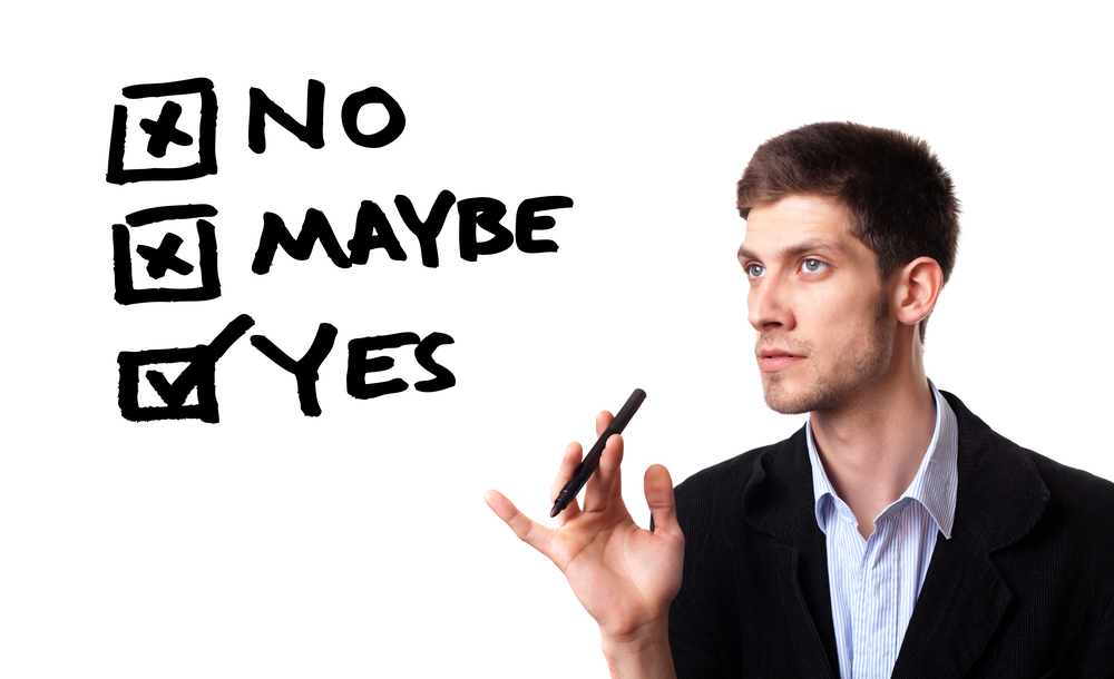 Person looking at answering checkbox questions of "No," "Maybe," and "Yes"