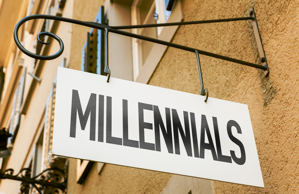 A business sign for "MILLENNIALS" hangs from a building, suggesting a need to address employee engagement for this generation and debunking the "Millennial Myth."