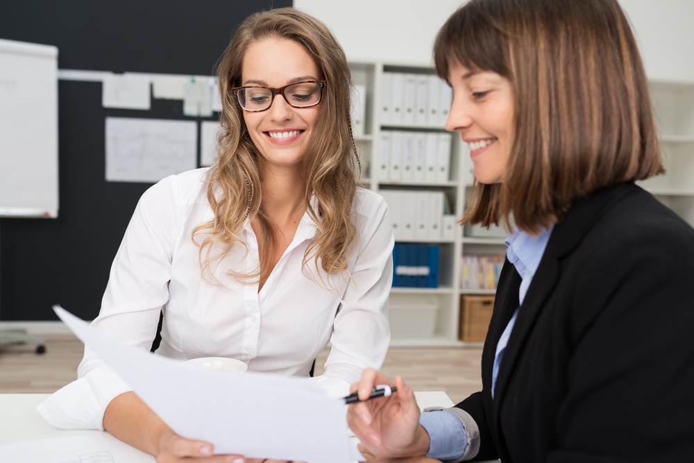 Close up Two Happy Young Businesswomen: Why it is harder for HR to manage expats in Sweden