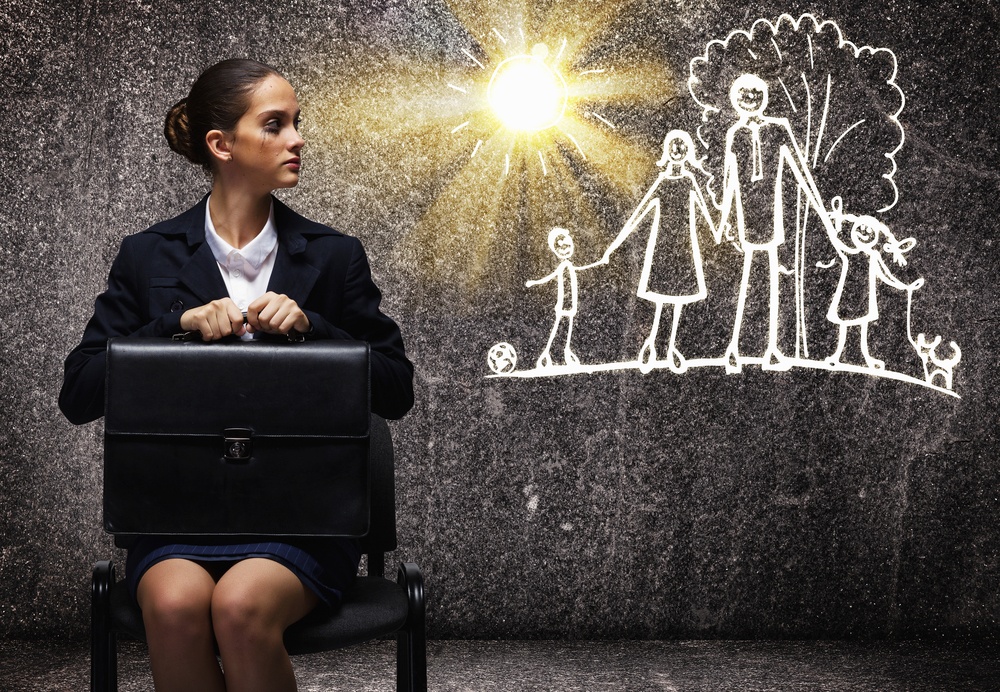 Young upset businesswoman sitting on chair with briefcase: Is work life balance possible for global mobility HR