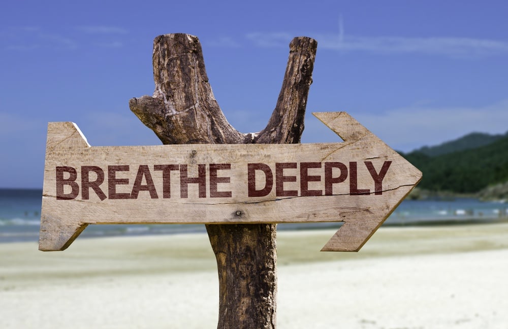 Breathe Deeply wooden sign with a beach on background.jpeg
