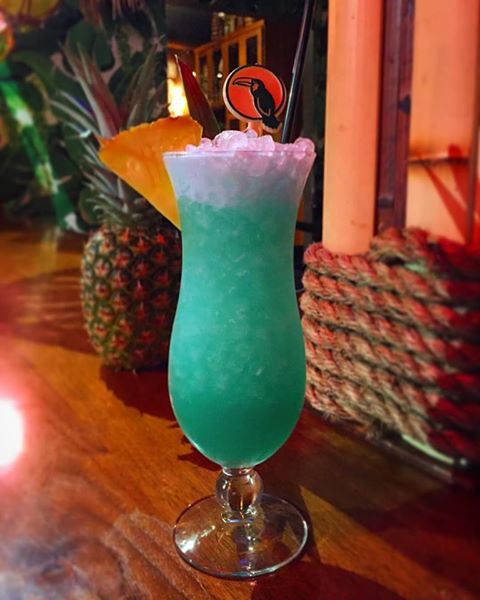 Blue Hawaii Cocktail With Personalized Drink Stirrers At The Jungle Bird.jpg