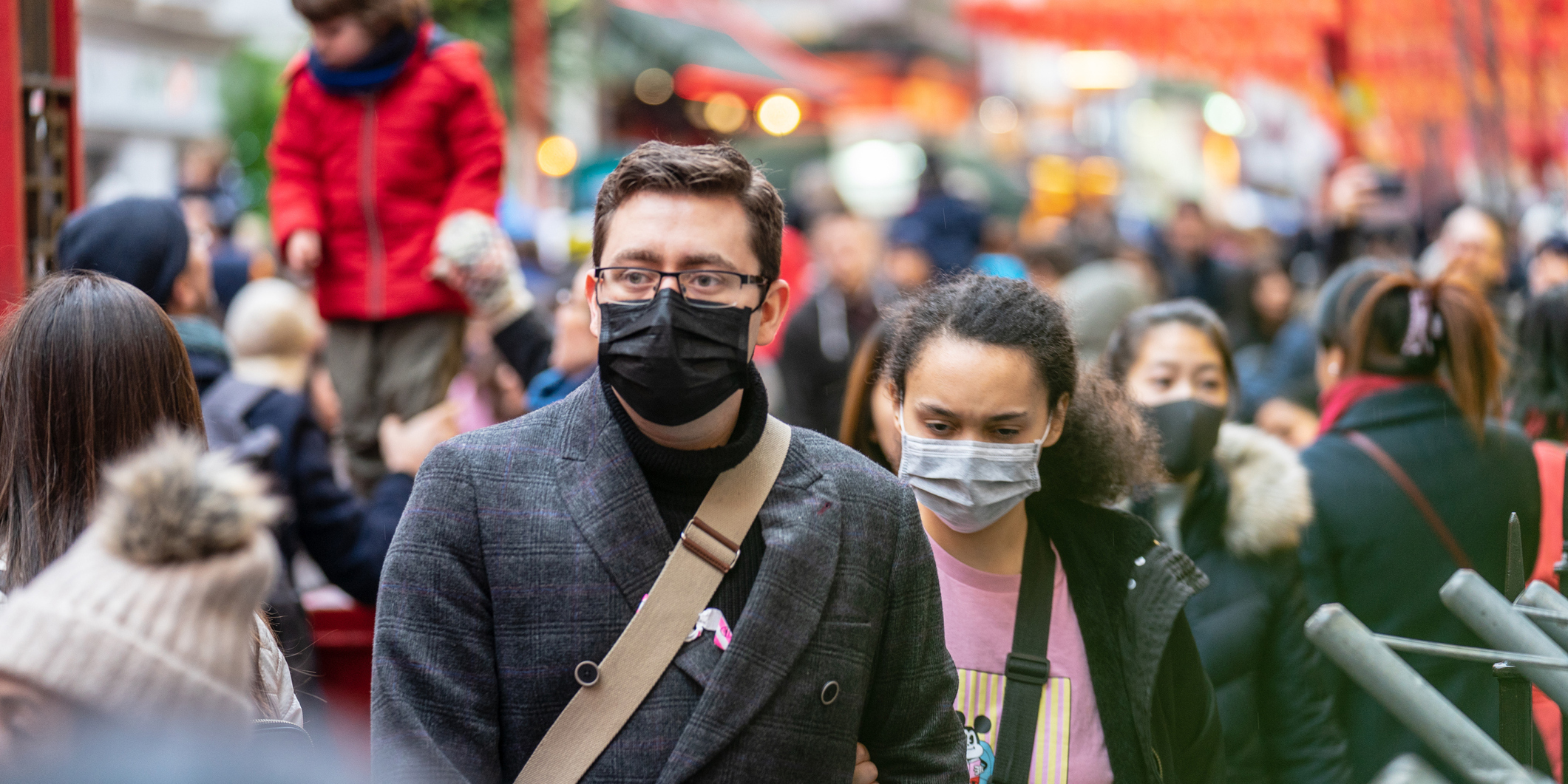 Two people with respirators avoiding Coronavirus exposure