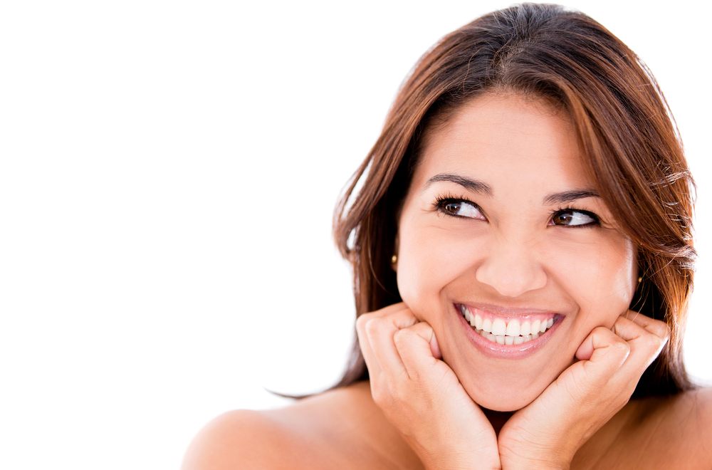 Happy thoughtful woman - isolated over a white background