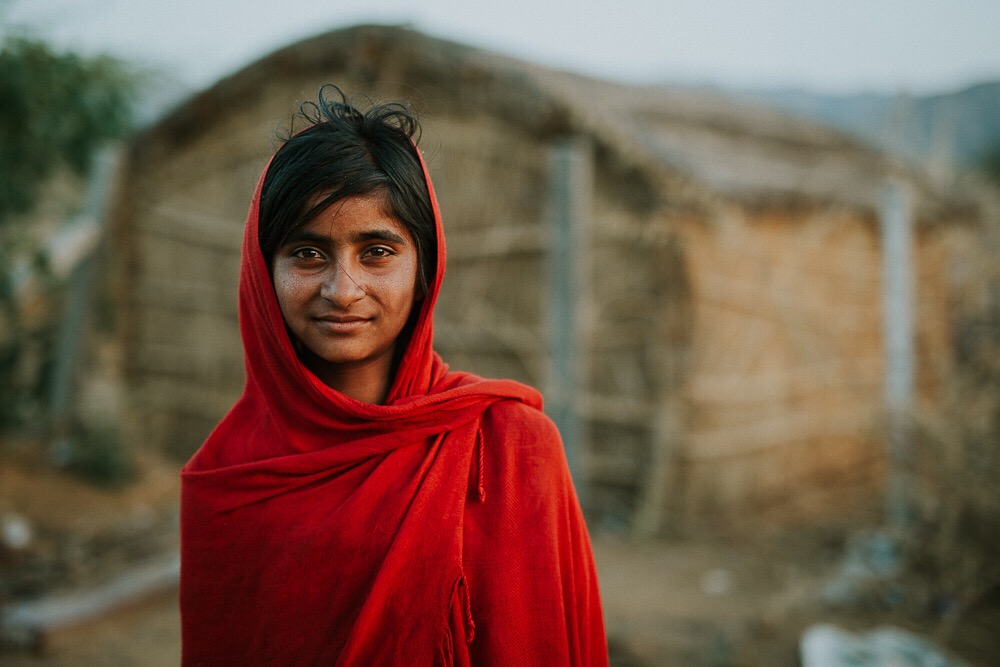 young person in an Indian village, representing the relationship between COVID-19 and human trafficking, making the world's poor most vulnerable to exploitation