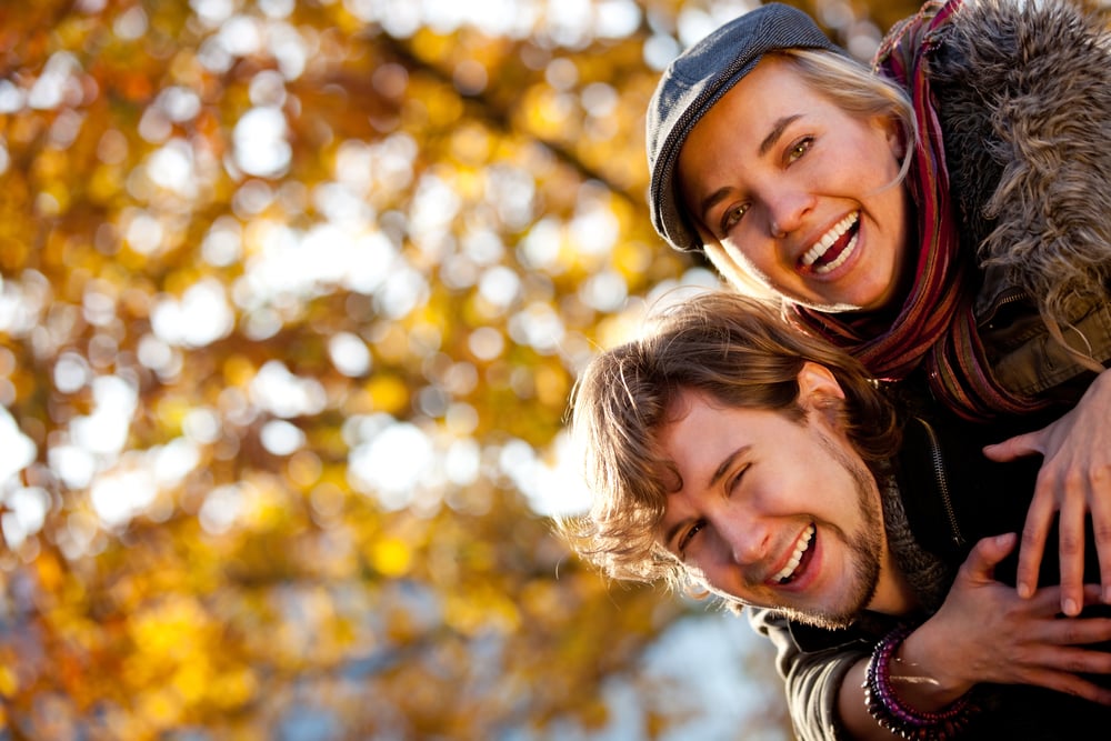 Loving couple smiling and enjoying the autumn season