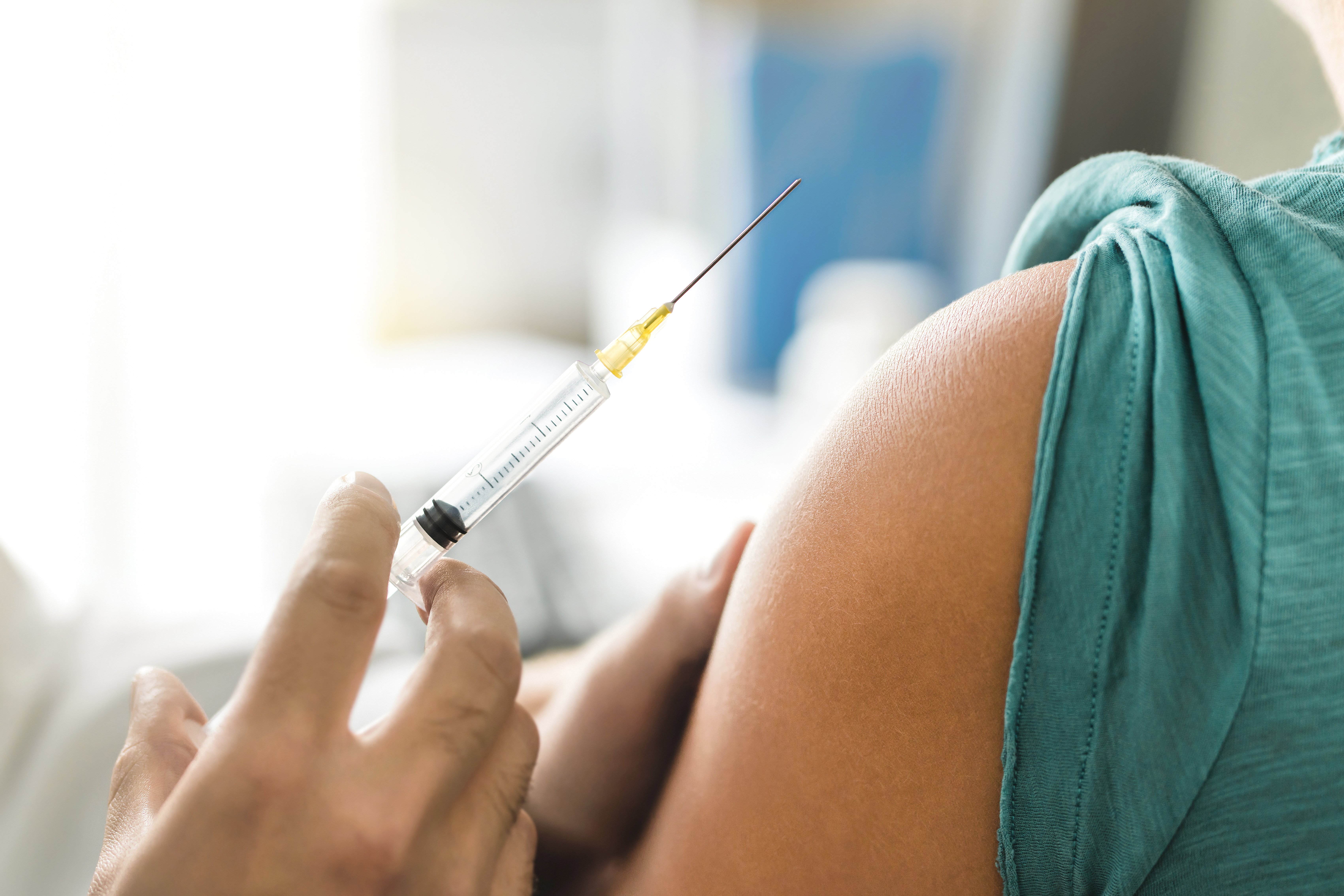 Woman receiving vaccination