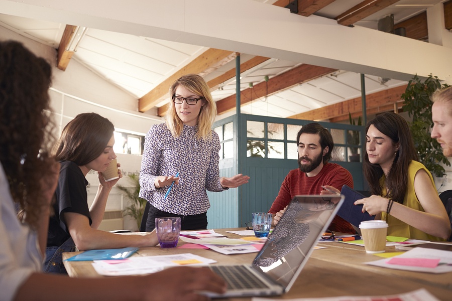 Female delivering training to group