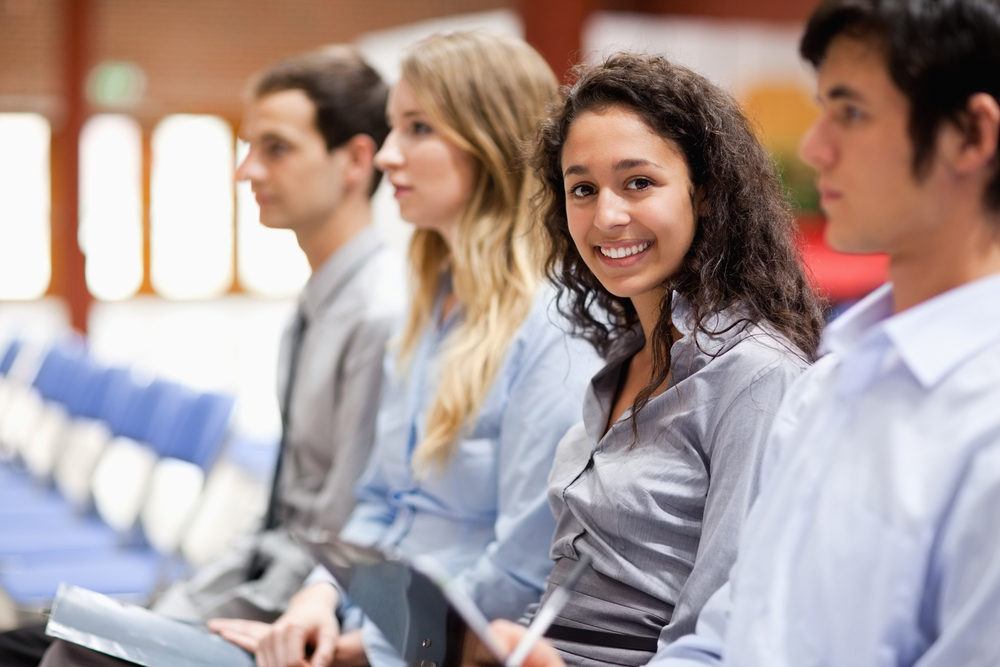 Businesswoman smiling at the camera during a presentation