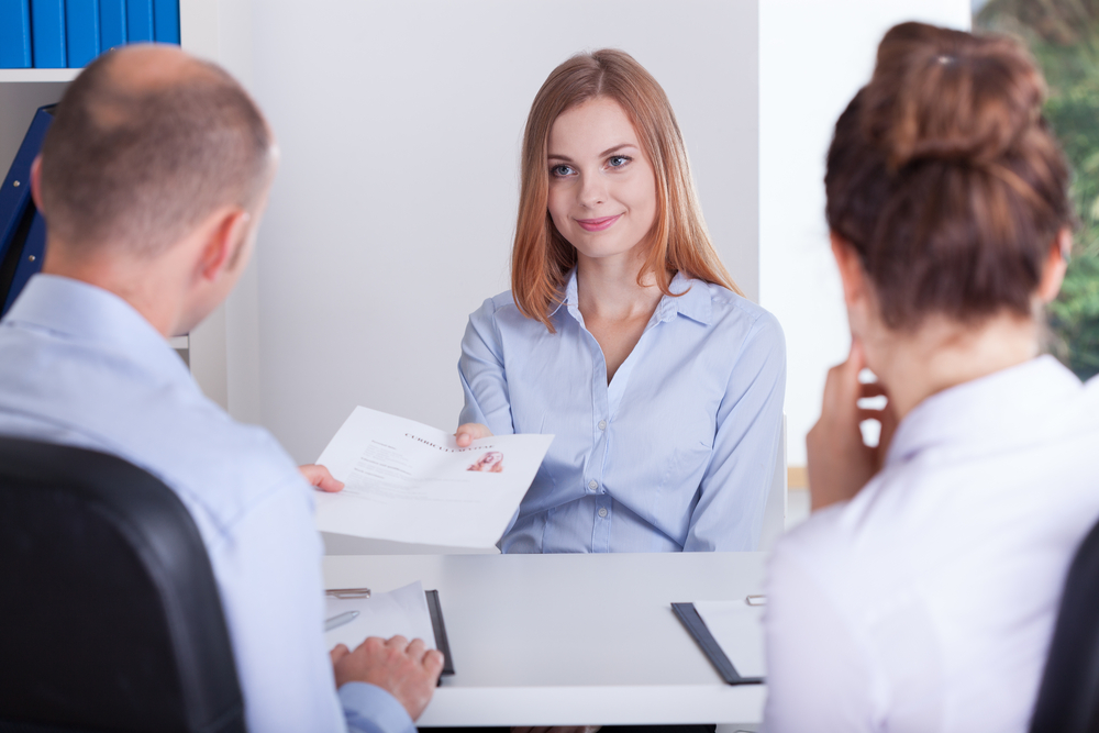 Young pretty woman and the beginning of her job interview