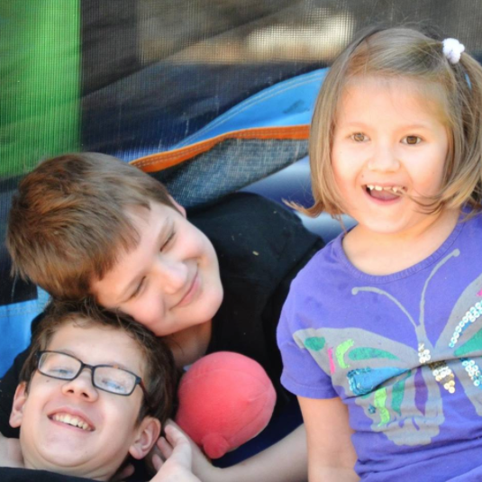 autistic sibling hanging out with his sister and brother