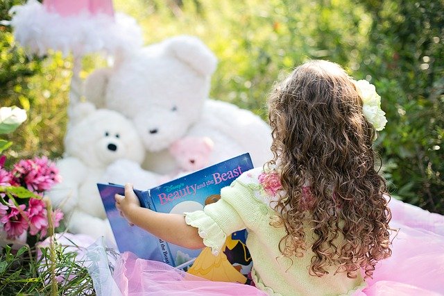 girl-reading-to-stuffed-animals