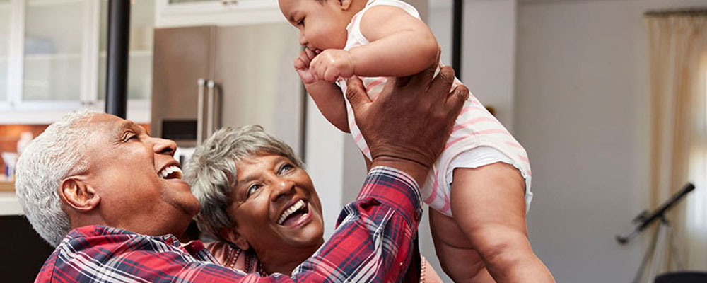 resources-library-featured-image-grandparents-holding-up-their-grandchild