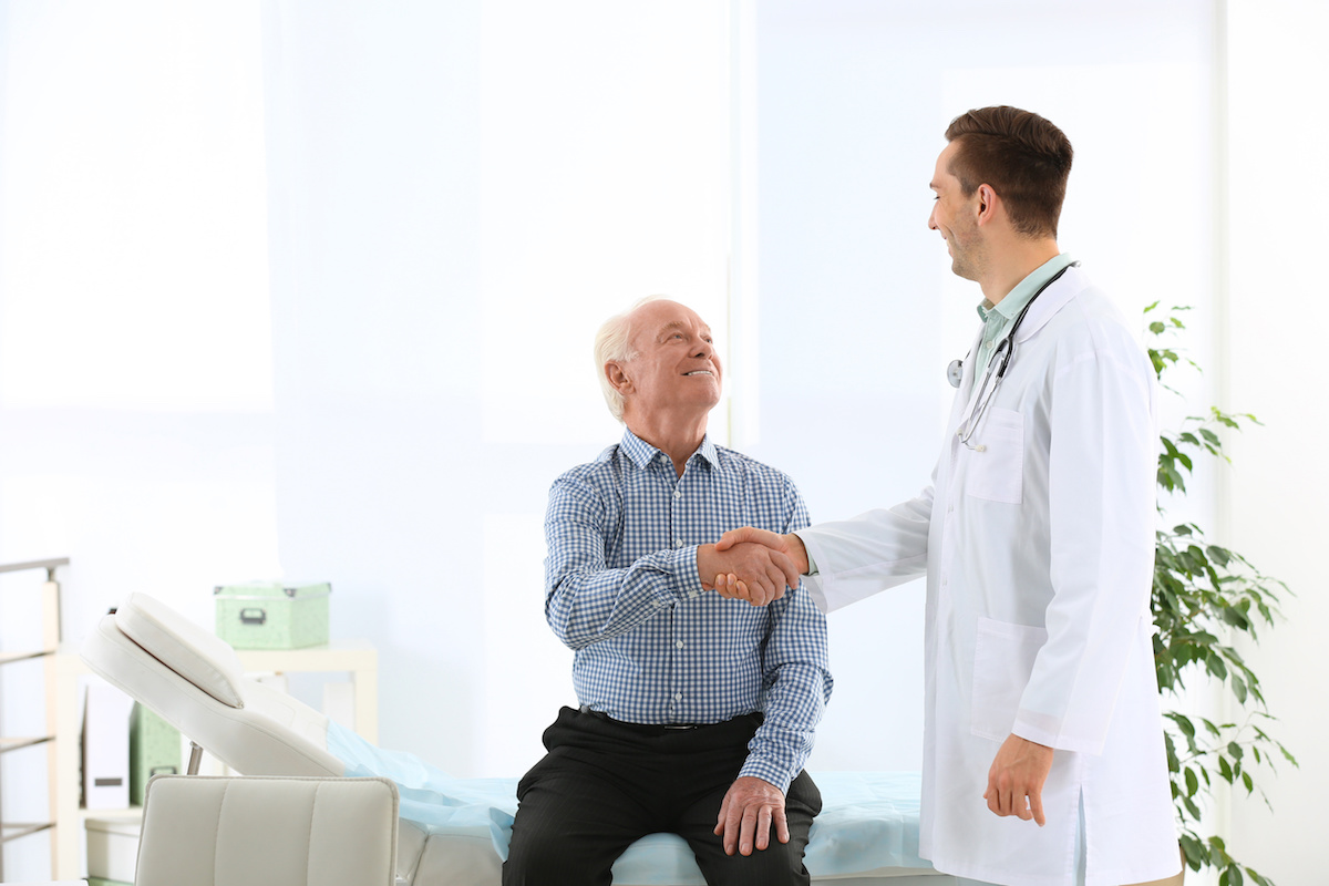 doctor shaking hands with patient