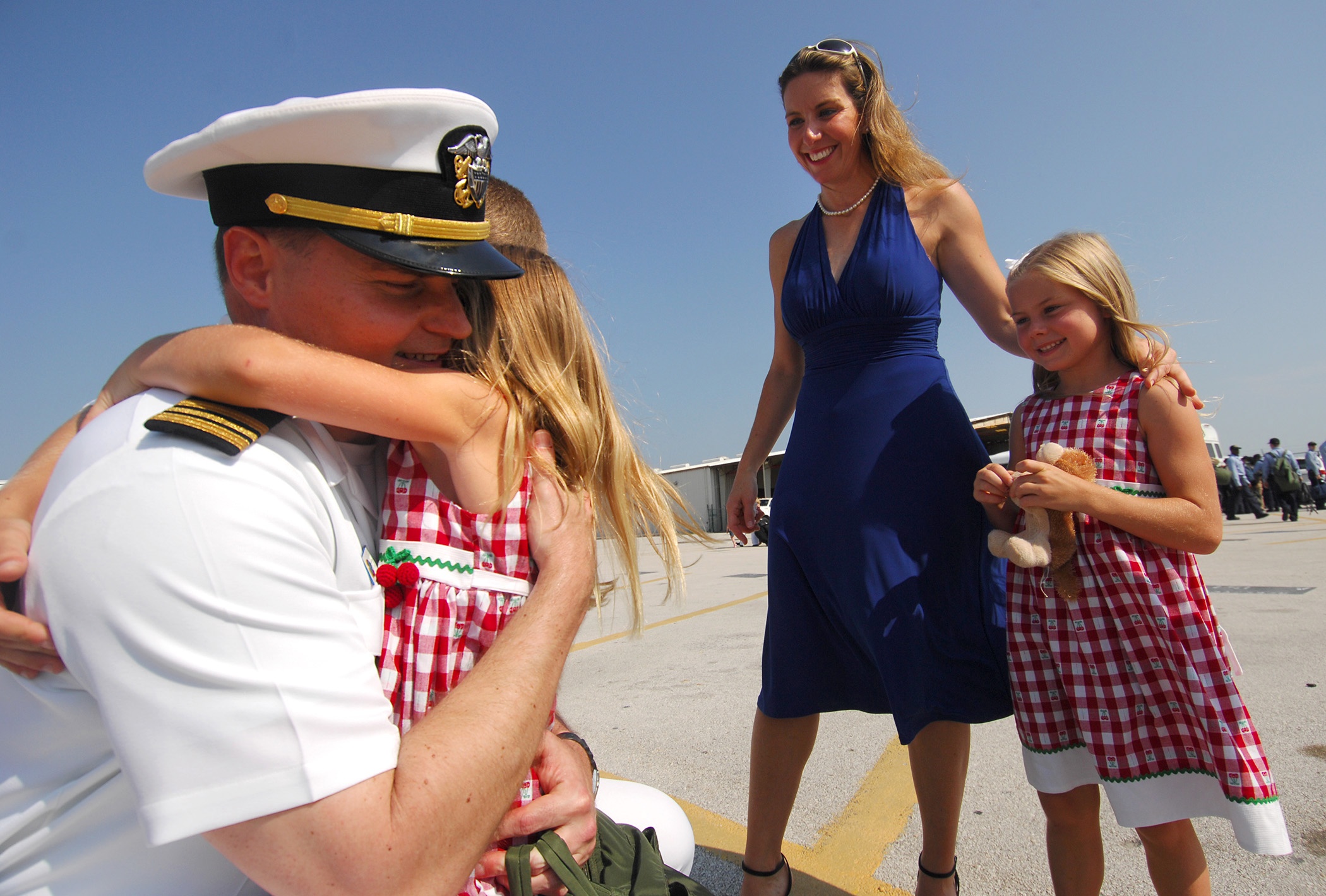 080601-N-2984R-320 MAYPORT, Fla. (June 1, 2008) Lt. Cmdr. Robert Strange, assistant air operations officer aboard the Nimitz-class aircraft carrier USS Harry S. Truman (CVN 75), is welcomed home by his wife and family. Truman and embarked Carrier Air Wing (CVW) 3 are in Mayport off-loading a small portion of CVW-3 and picking up tiger cruise riders, preparing for their return to homeport after a seven-month deployment. U.S. Navy photo by Mass Communication Specialist 3rd Class Ricardo J. Reyes (Released)