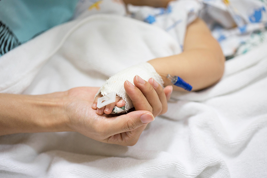 parent holding child hand