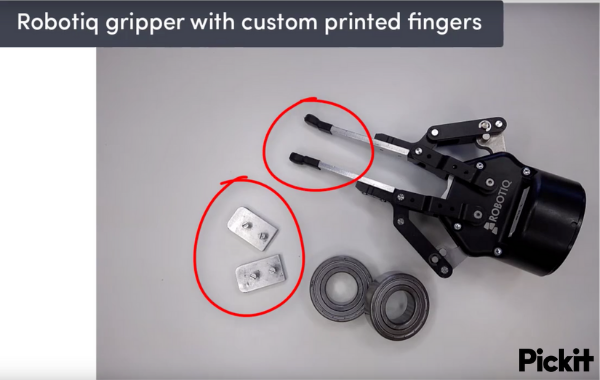 Robotiq gripper with custom 3D printed fingers to allow for a better grip in a bin picking application