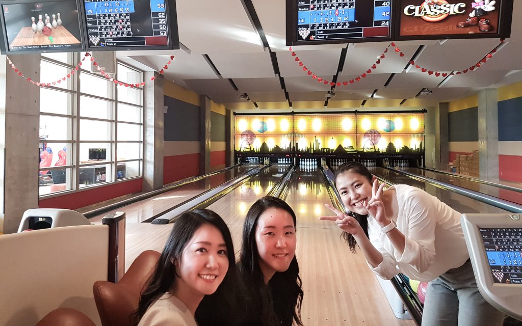 coworkers in bowling alley