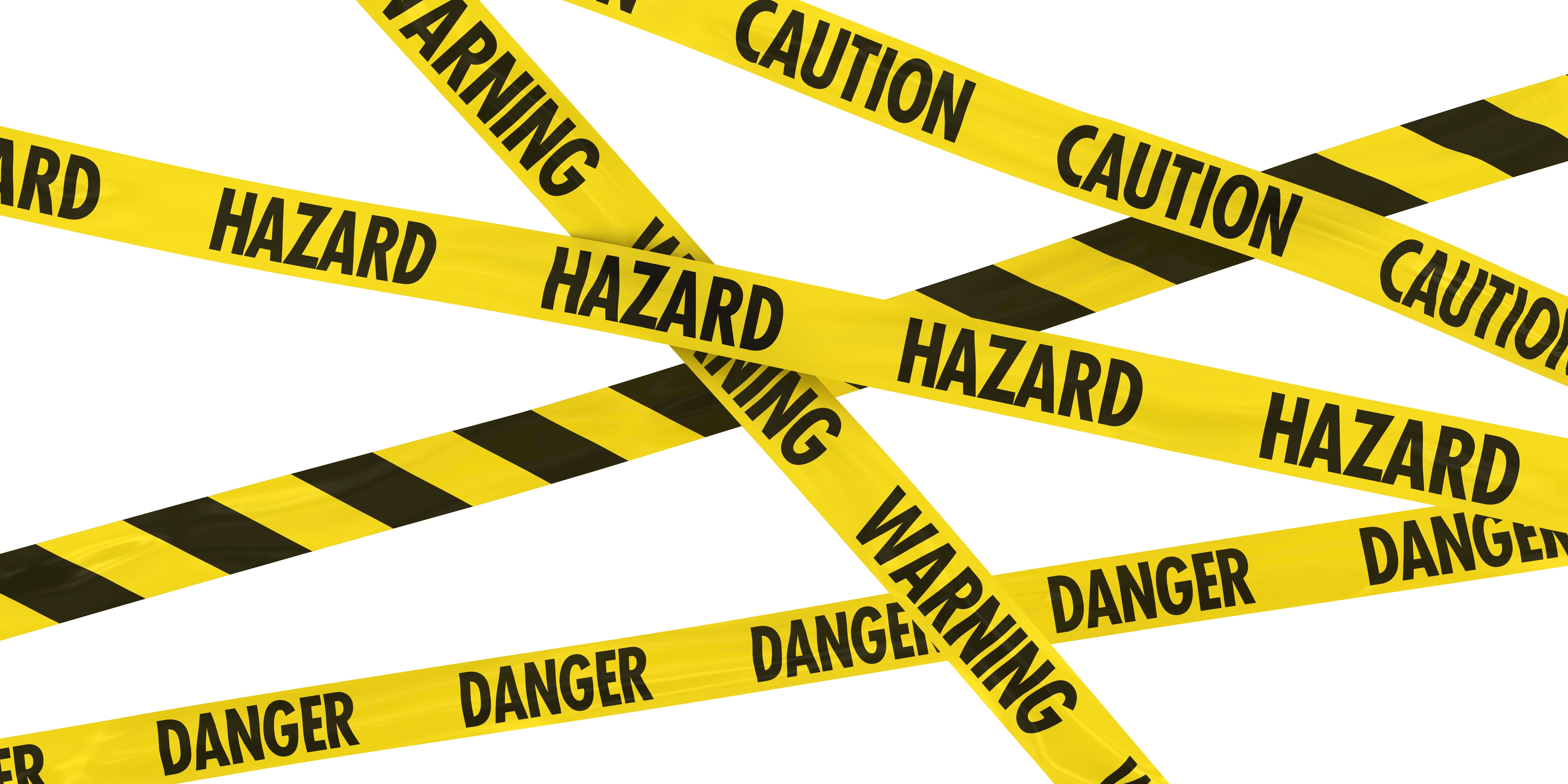 Overlapping Caution, Warning, Danger and Hazard Tape Background