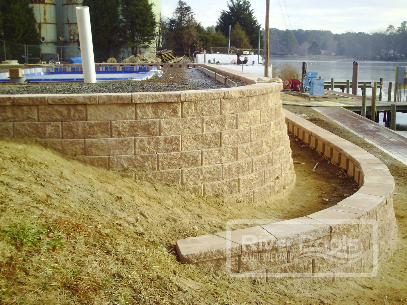 fiberglass pool with retaining wall