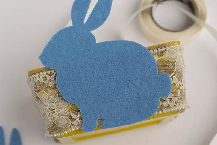 twine-wrapped-easter-basket-adding-felt-bunny-to-front-of-basket.jpg