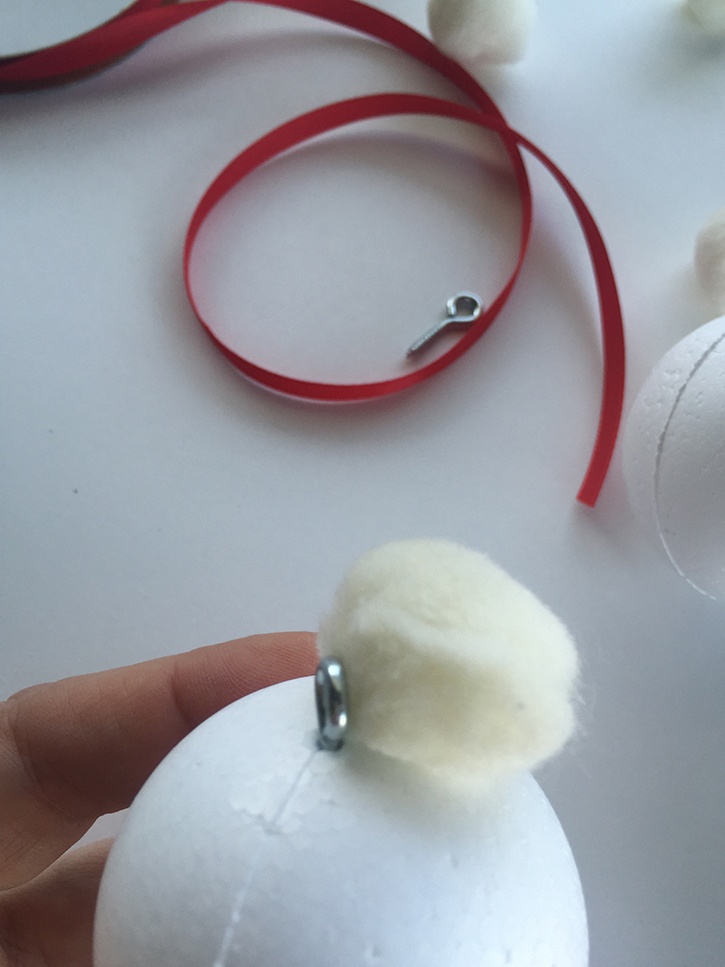 glue-dots-rustic-pom-pom-ornament-adding-pom-poms-to-ball.jpg