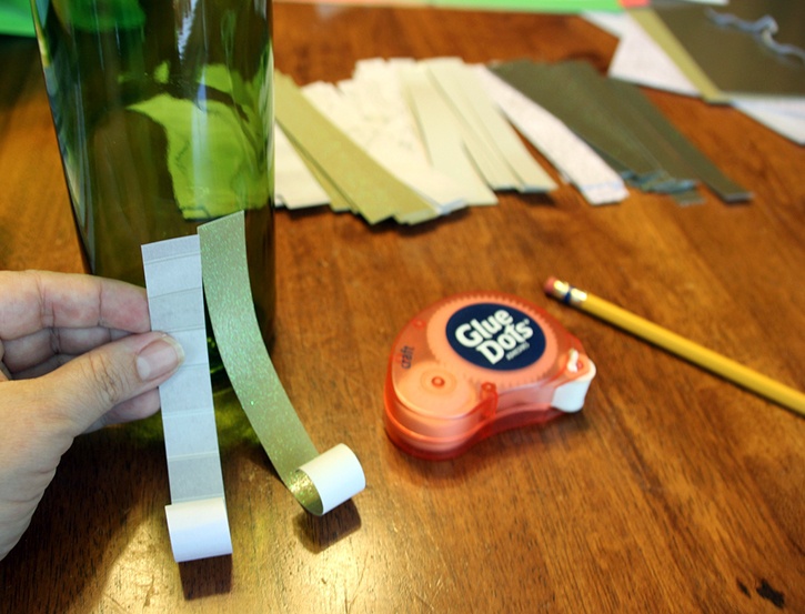 glue-dots-paper-scrap-wine-bottle-christmas-tree-gluing-to-tree.jpg
