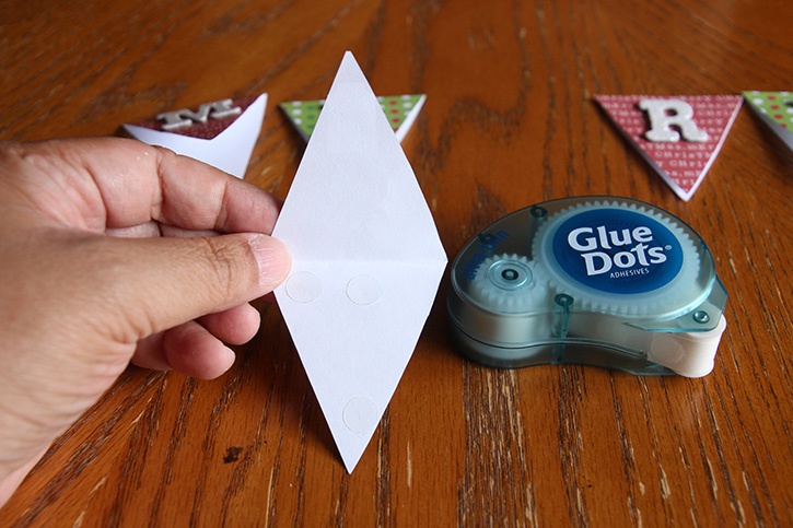 glue-dots-merry-gift-wrap-banner-gluing-paper-pieces-closed.jpg