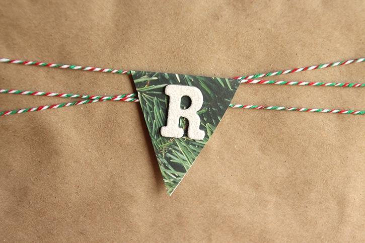 glue-dots-merry-gift-wrap-banner-piece-wrapped-around-twine.jpg