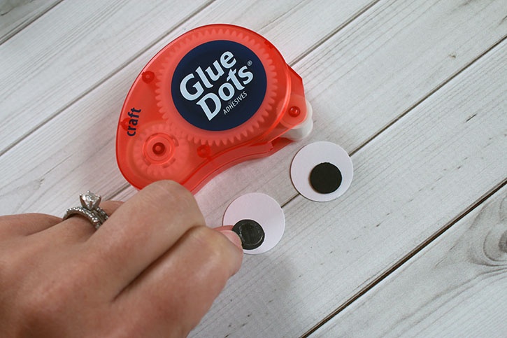 glue-dots-halloween-monster-treat-bags-craft-glue-dots-adding-eyes.jpg