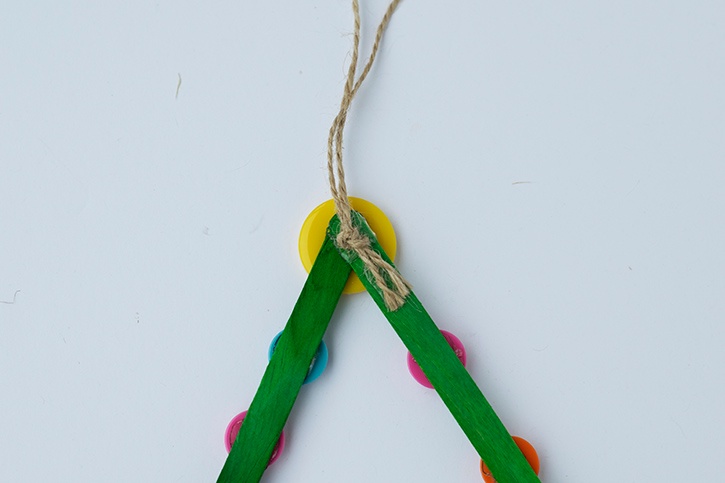 glue-dots-craft-stick-christmas-tree-button-ornament-twine-hanger-on-back.jpg