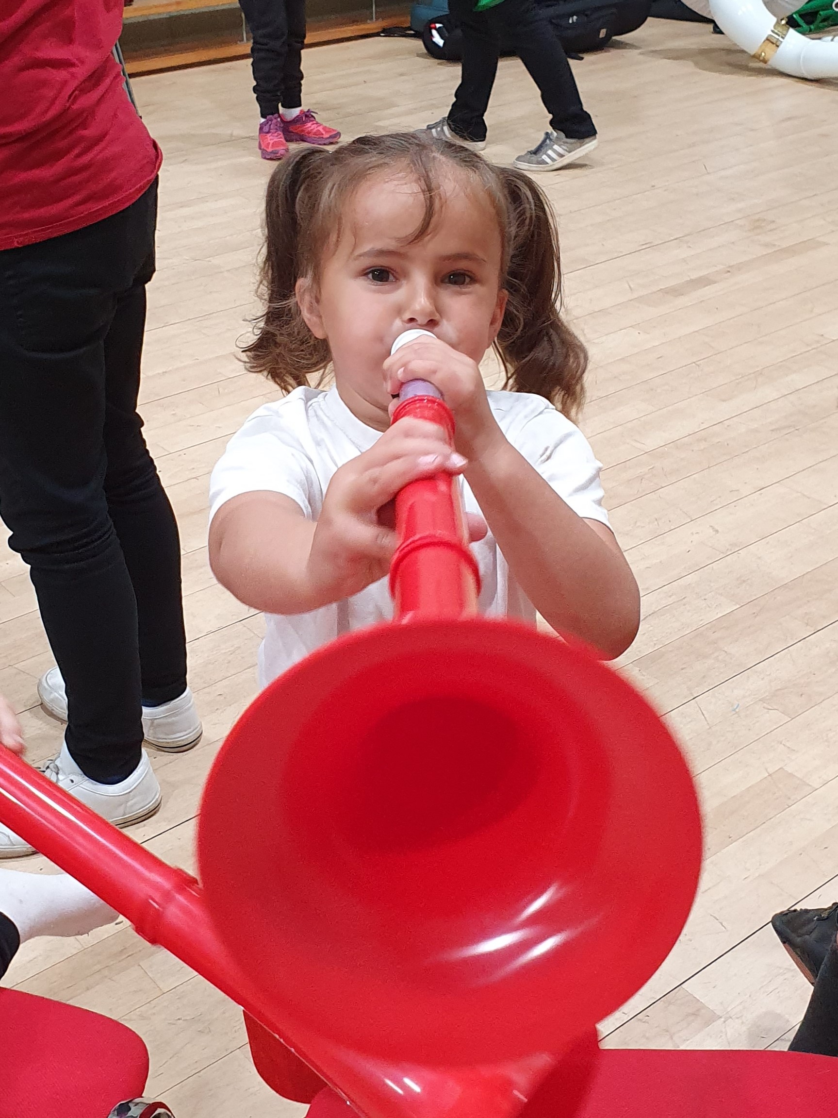 A child playing a pBuzz.