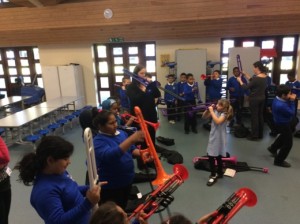 Students playing pBone musical instruments.
