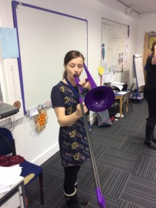 Musician playing pBone in class.