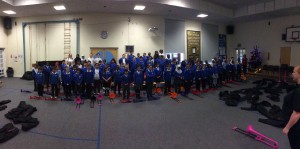 A group of school children rehearsing for a music concert.