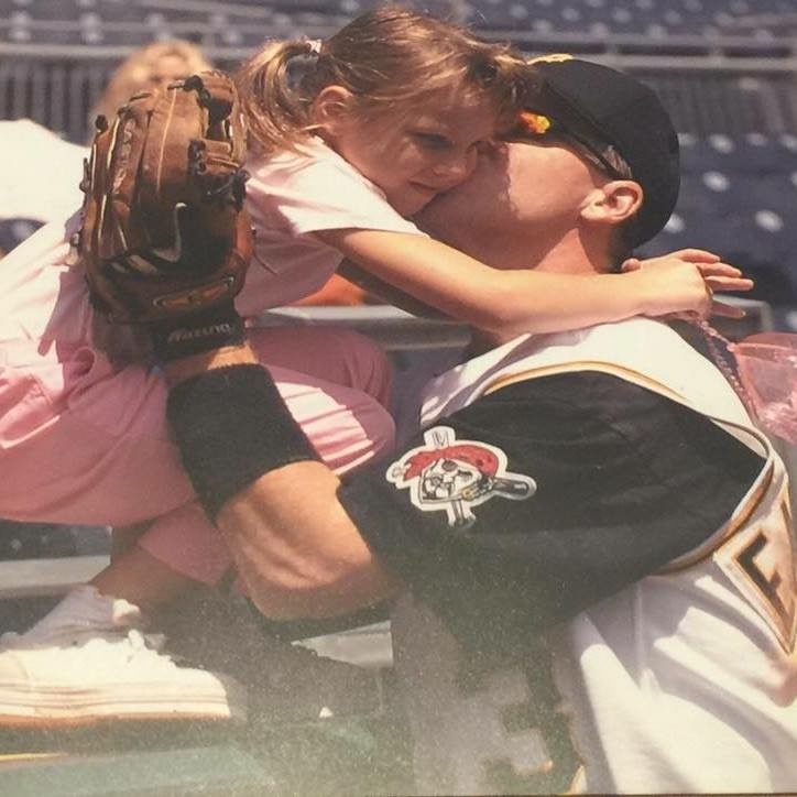 EM Media's agencies' daughter getting a kiss from a Pittsburgh Pirates 