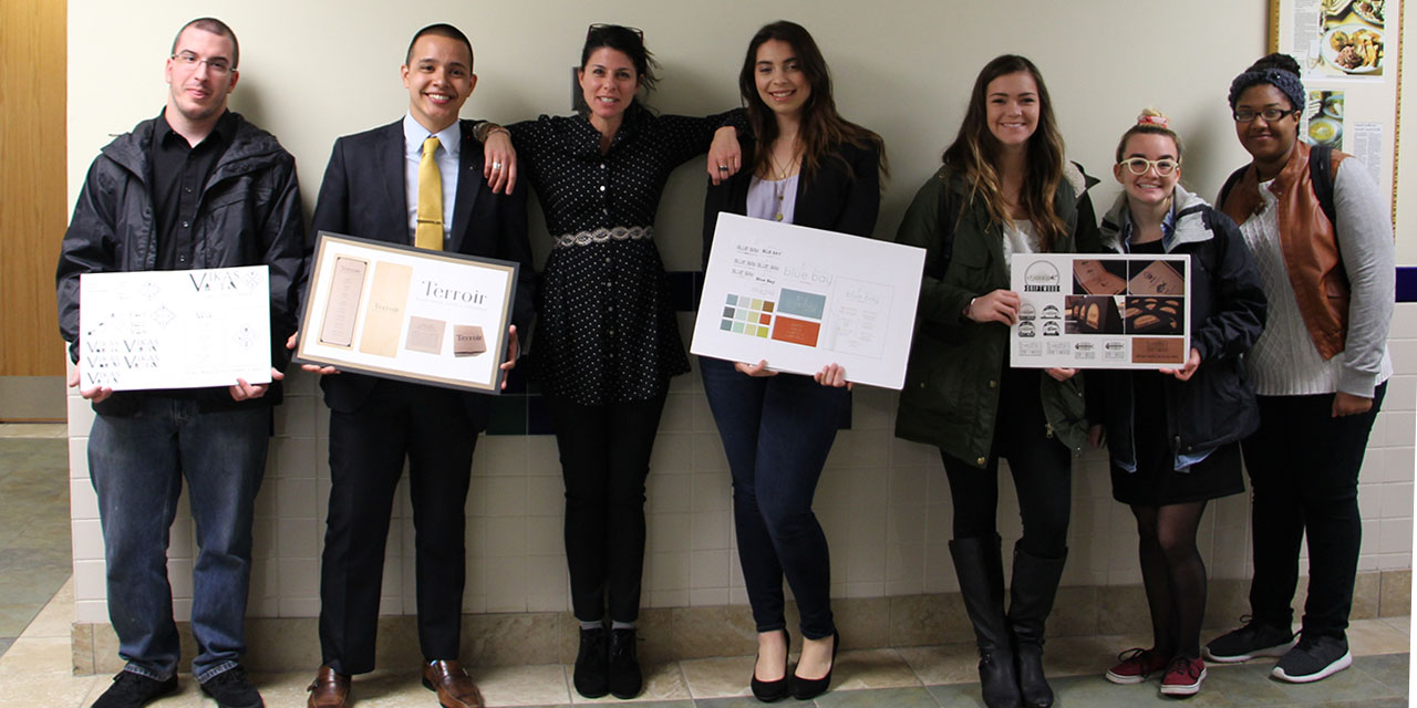 L to R: Mike Dulski, Ray Nunez, Professor Marzocchi, Karissa Palmer, Nicole Hudon, Genevieve Dugan, Tenesha Day Professor Marzocchi with half of her student designers