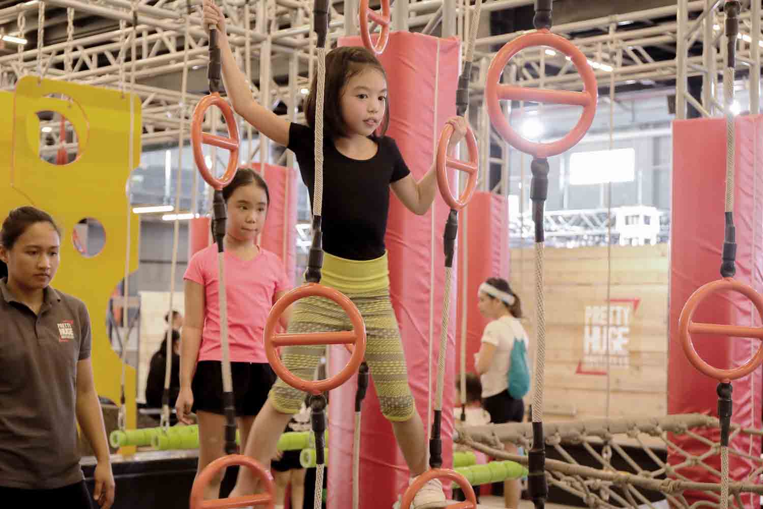 Girl moving through rungs at PHO_Fun Exercises for Healthier Kids