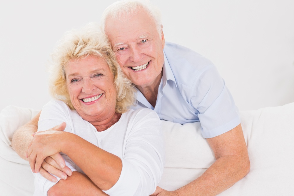 JUL24-Old couple hugging sitting on the sofa.jpeg