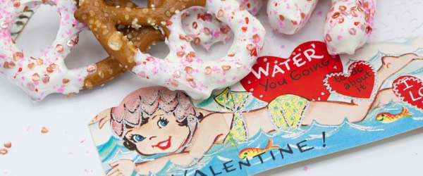 Pink and Silver Edible Glitter on a pretzal for valentines day