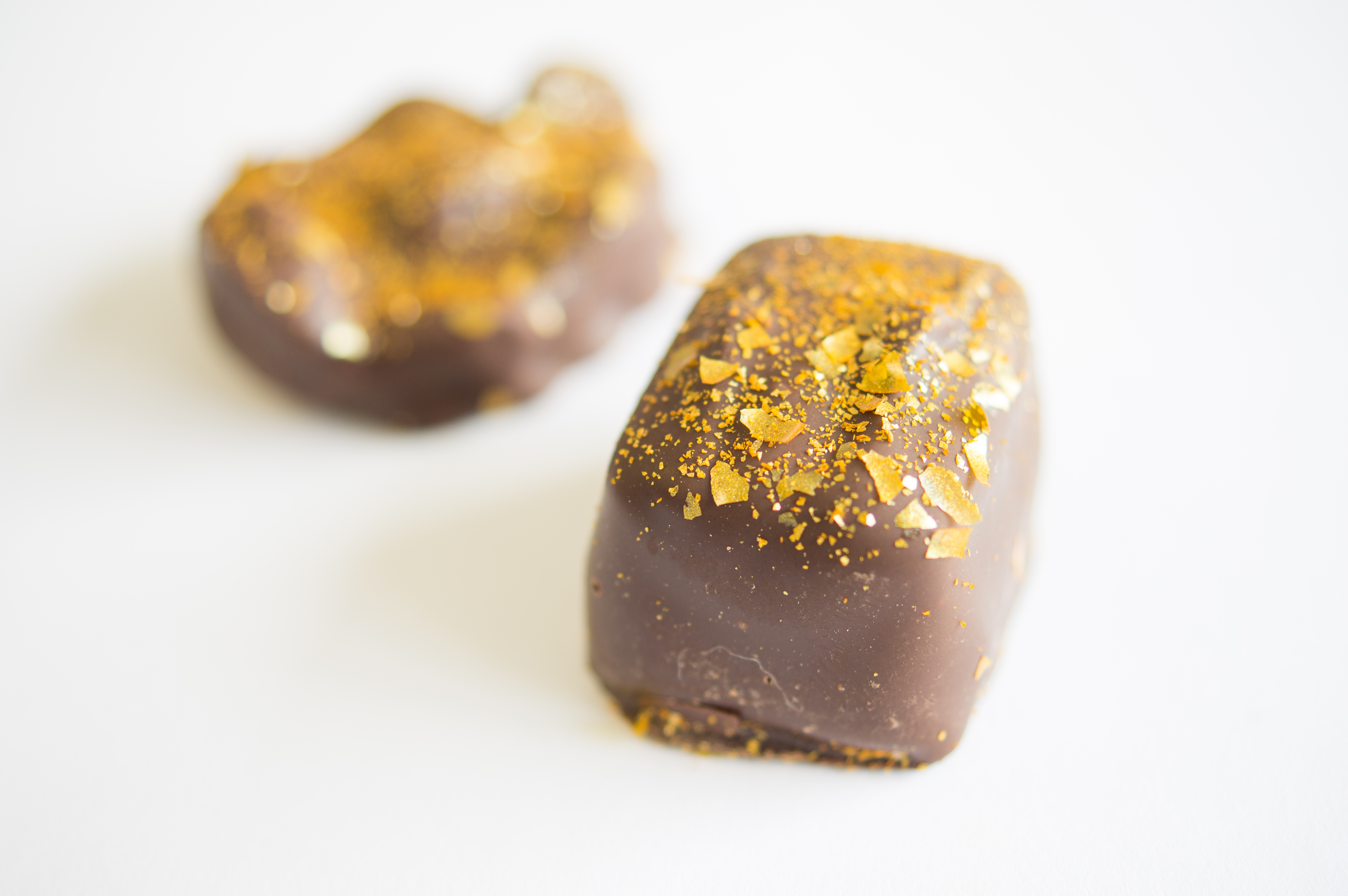 Gold Edible Glitter Flakes on Chocolate Candy