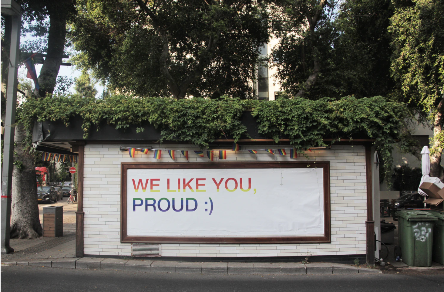 sign on side of road that says "we like you proud :)"