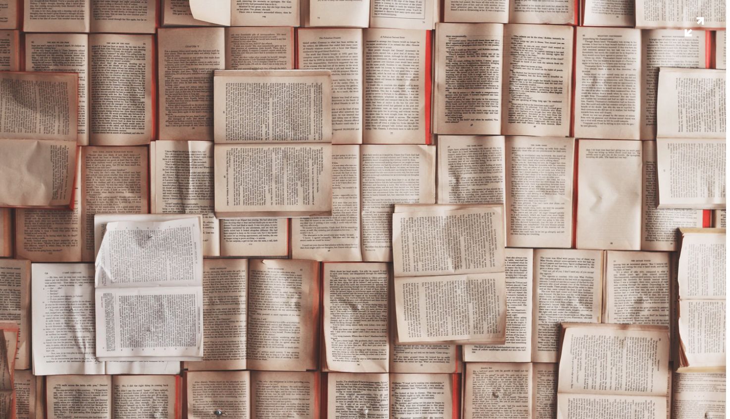 lots of open books layered next to each other