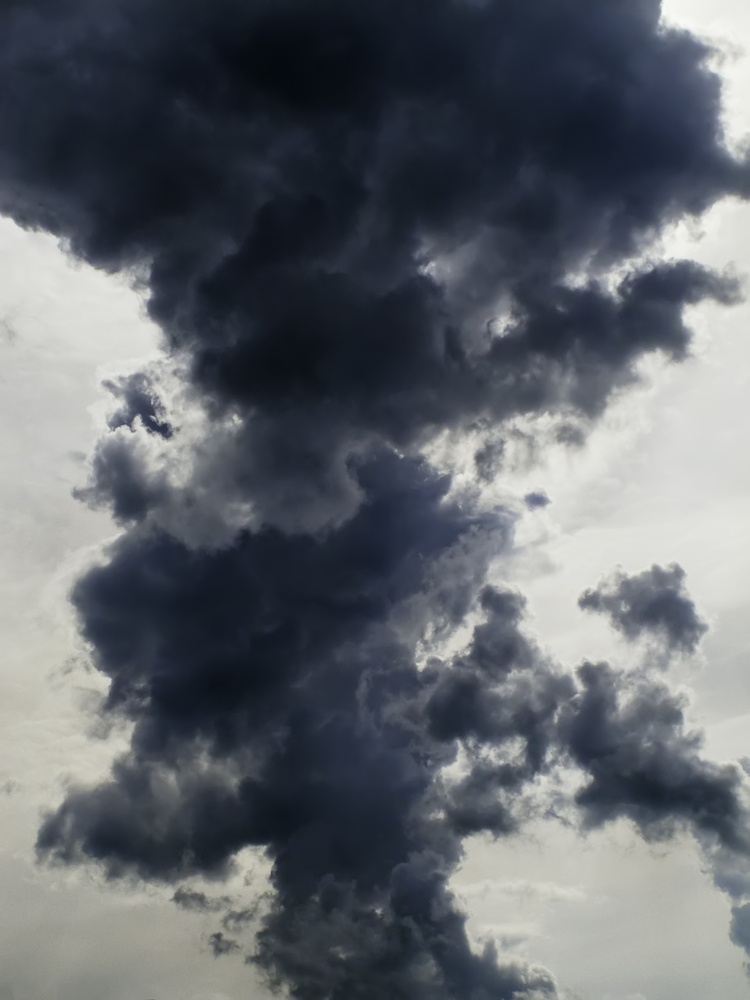 Ominous cloud before a storm that never happened Vertical cloud formation, evocative of a mushroom cloud after a nuclear explosion, hiding the afternoon sun on a spring day in northern Illinois, USA